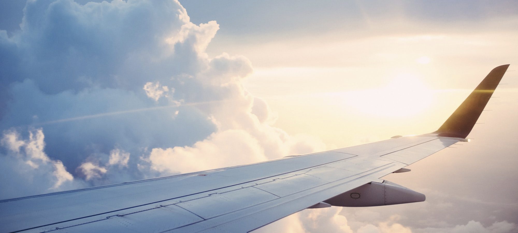 Aircraft wing above cloud at altitude