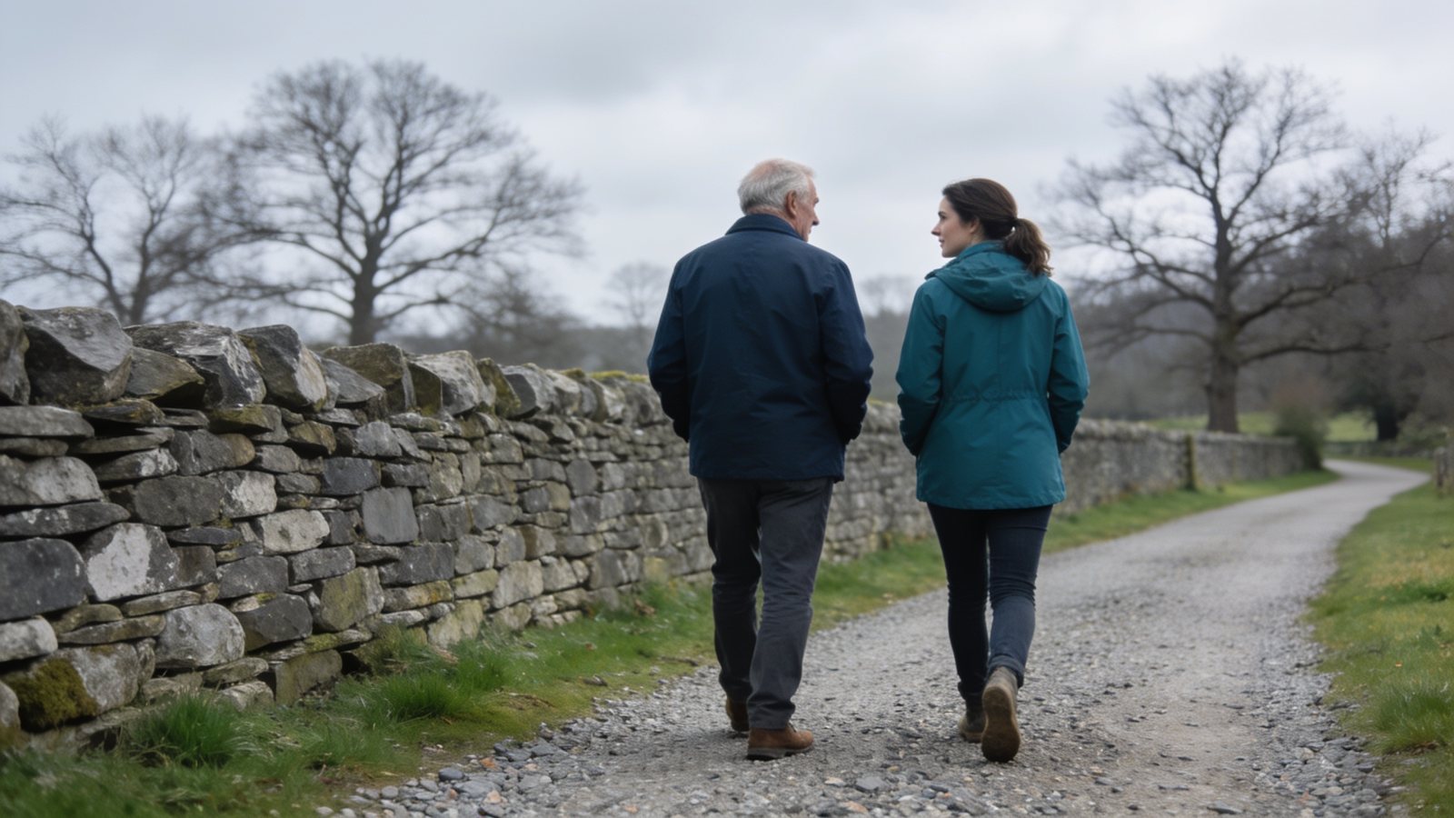 Two generations walking together along an estate path